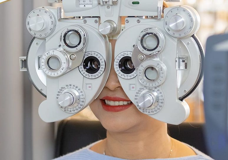 Adult eye exam with phoropter