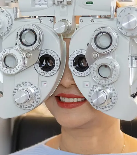 Adult eye exam with phoropter